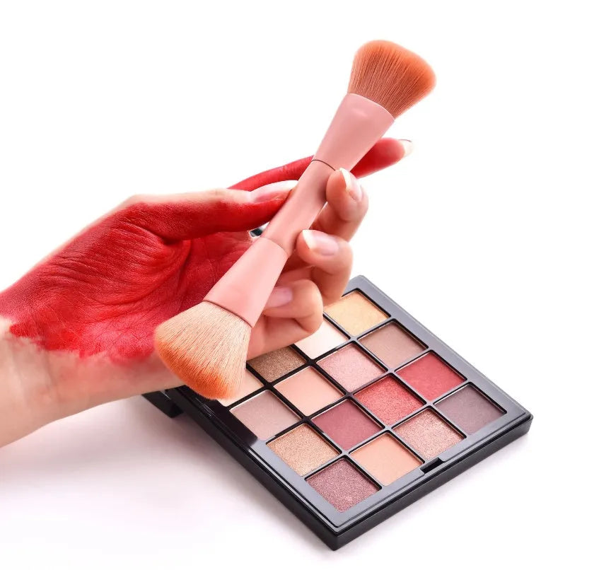 Ten professional makeup brushes with wooden handles including powder, foundation, and double-ended brushes.