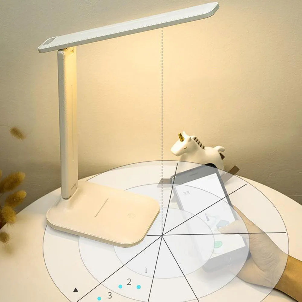 White touch dimming colour-changing bedside lamp with USB charging cable.