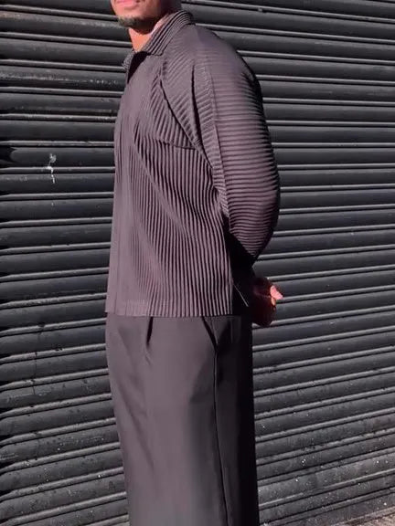 Black men's pleated long-sleeved polyester top showing vertical texture detail