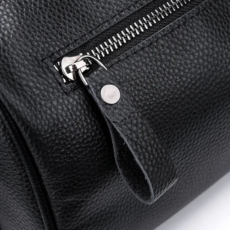 Black genuine leather women's crossbody bag with one-shoulder strap showing 24x16x13cm dimensions