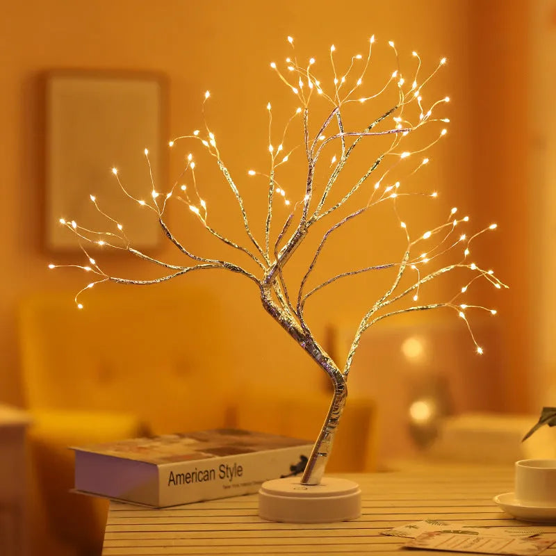 Tree light night light with bonsai-style design, warm white LED lights, adjustable branches, and USB plug.