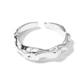 Irregular silver opening adjustable ring for women with electroplated finish on plain background