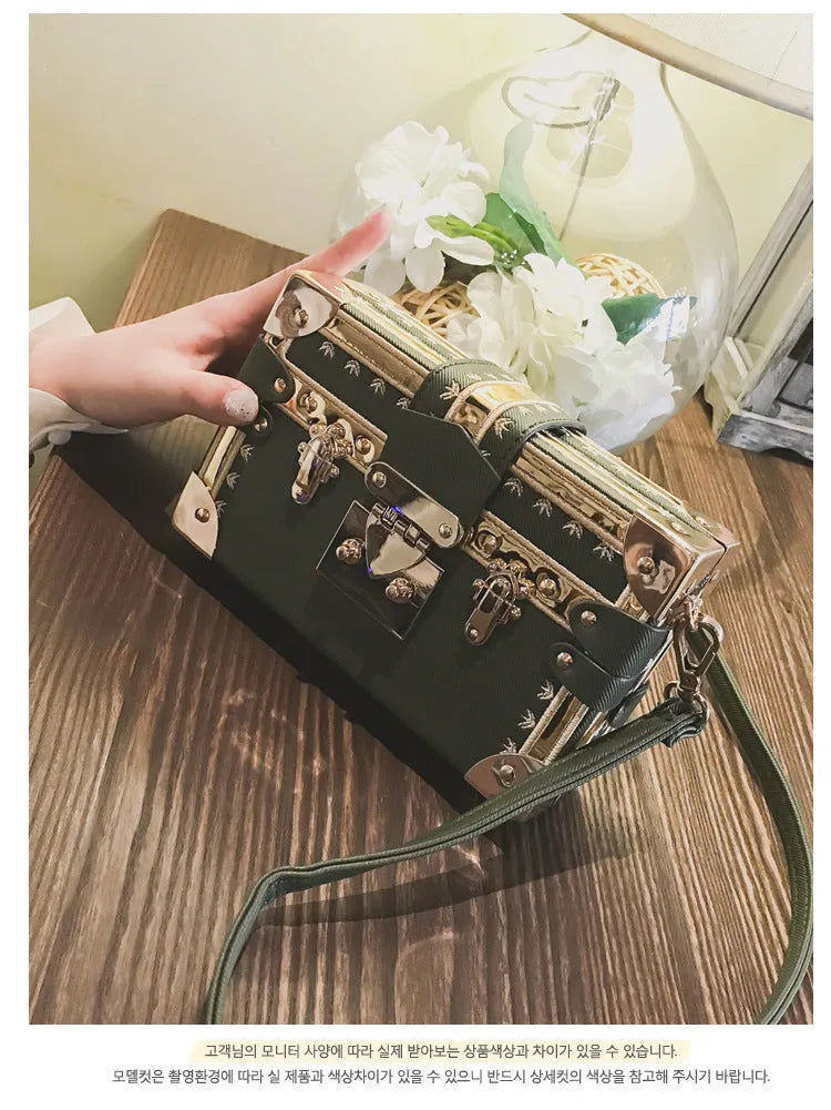 Women's hard PU leather shoulder bag with single adjustable strap and flap closure