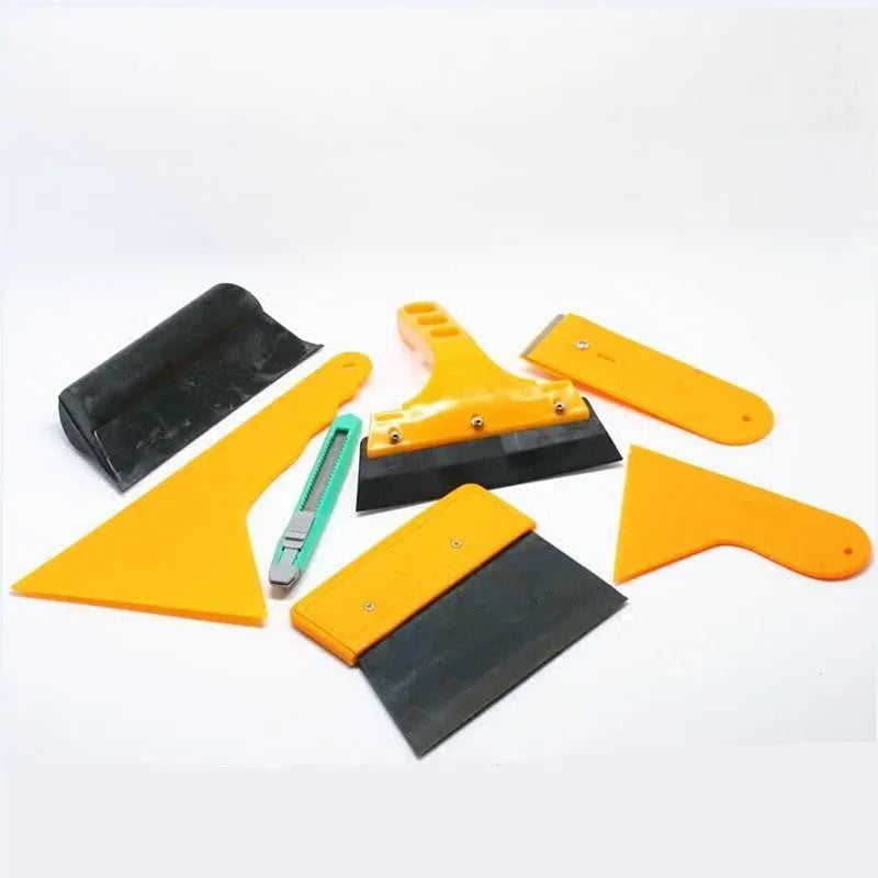 Seven-piece car film tool set with scrapers, knives, and applicators for automotive and screen protector installation.