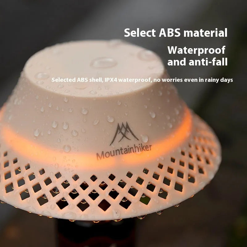 Beige wine bottle shaped camping lantern showing three light modes and USB-C port.