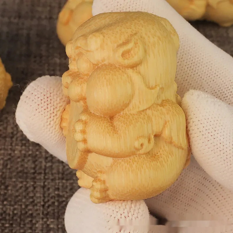 Solid bamboo carving ornament shaped as a traditional Money Toad, measuring 4.5cm in height.