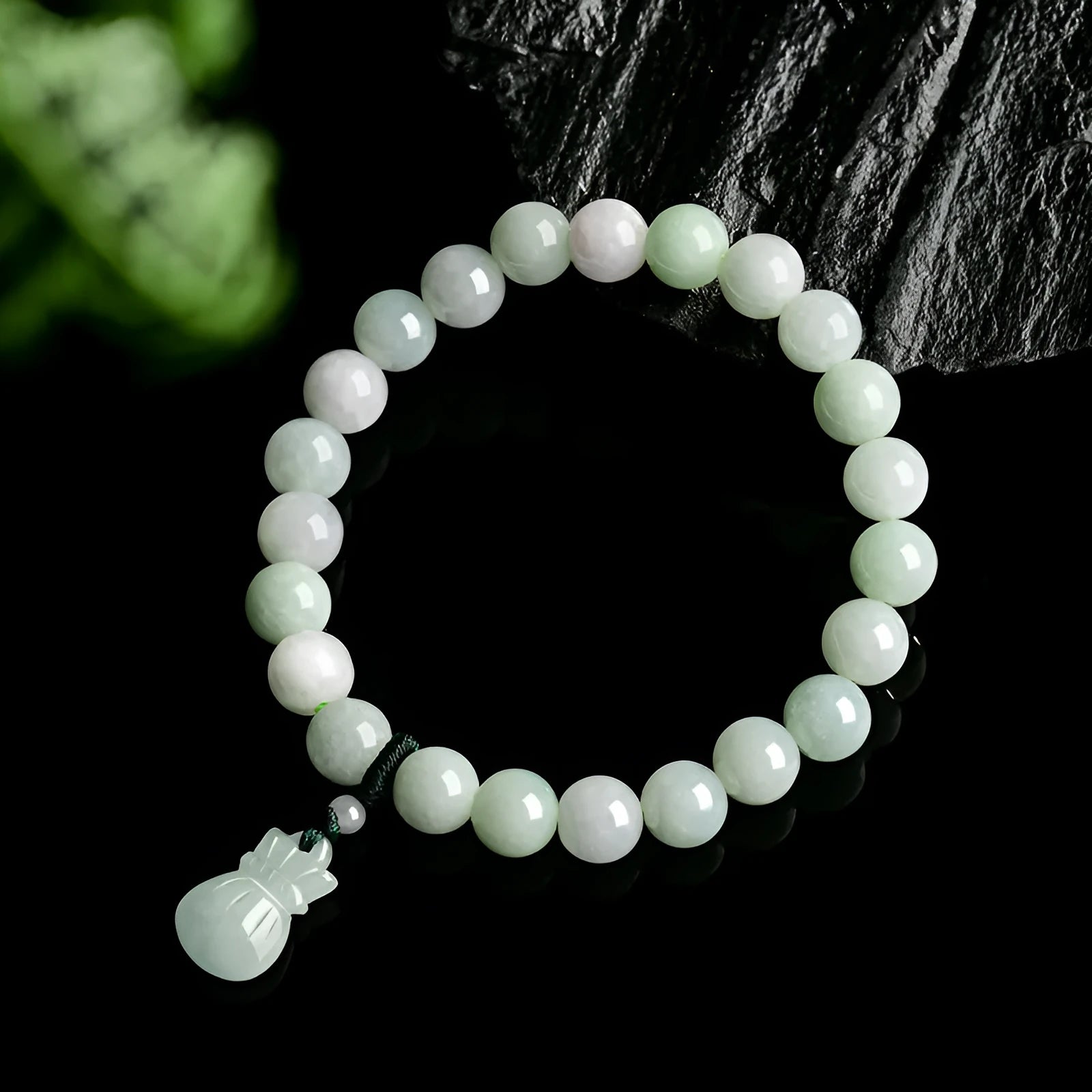 Jade purse bracelet with 8mm floral beads on wrist, traditional Chinese unisex design