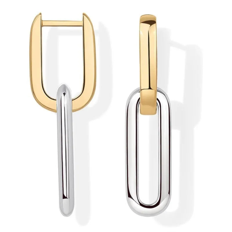 14K gold and silver two-tone geometric U-shaped earrings on a light background showing the copper core and metallic finish