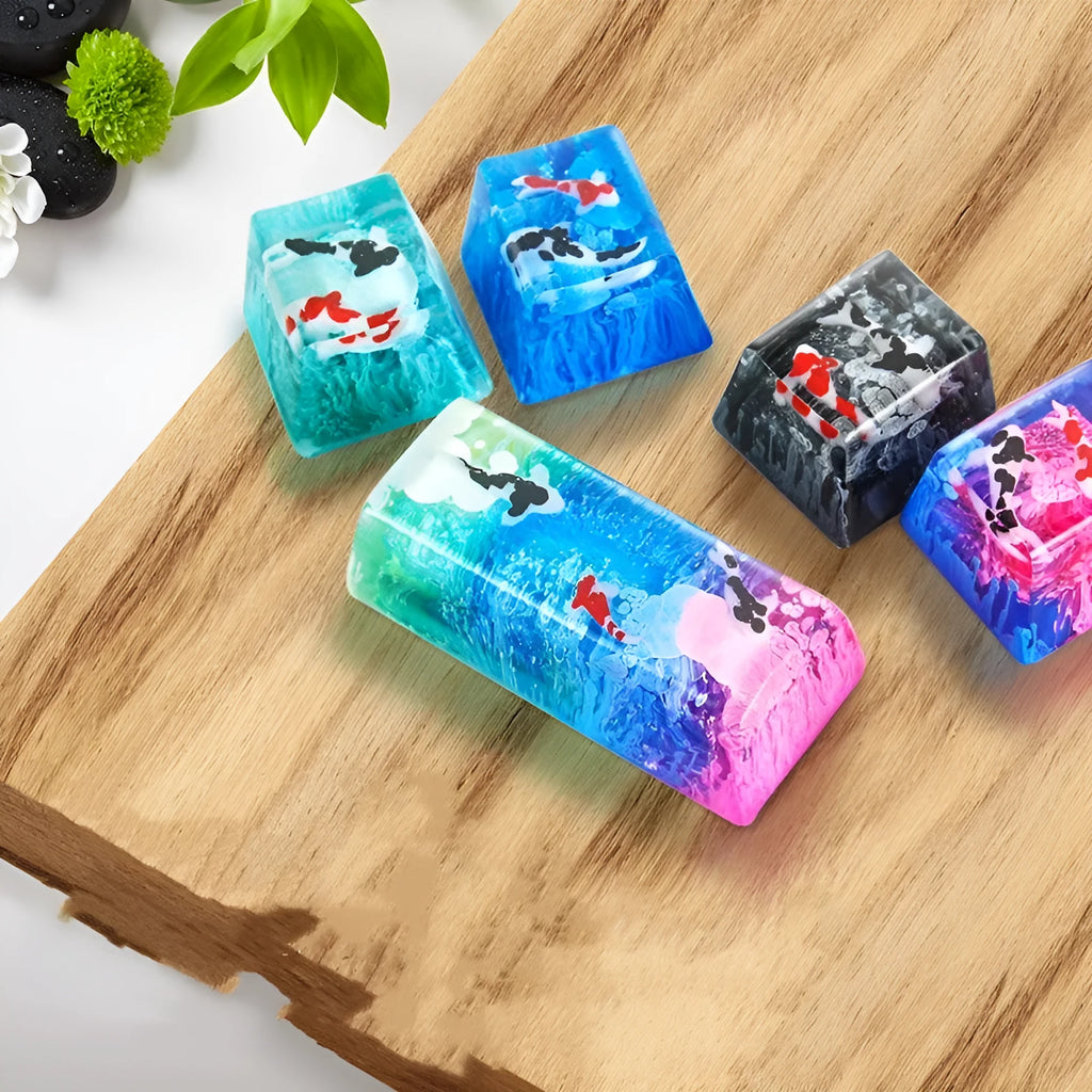 Resin keycap with koi fish swimming through scenery design for Cherry MX mechanical keyboards