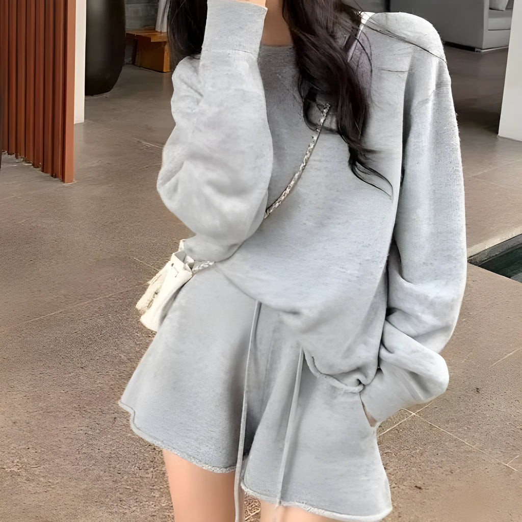 Women's loose-fitting long sleeve sweater and knitted wide leg shorts two-piece set in oatmeal colour.