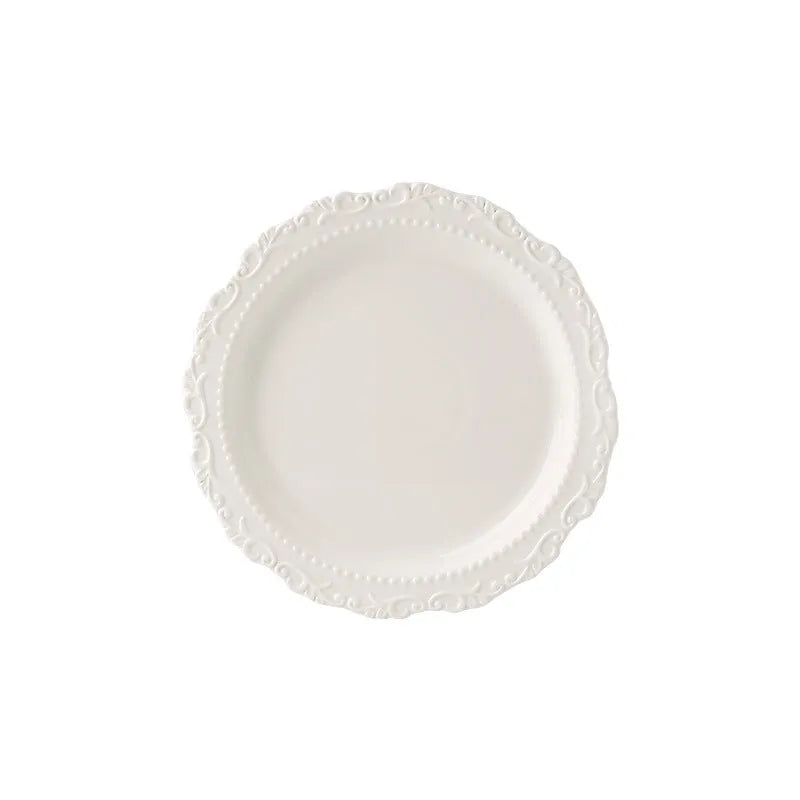 Cream ceramic lace vintage plate with irregular shape and coloured glaze, in white or yellow