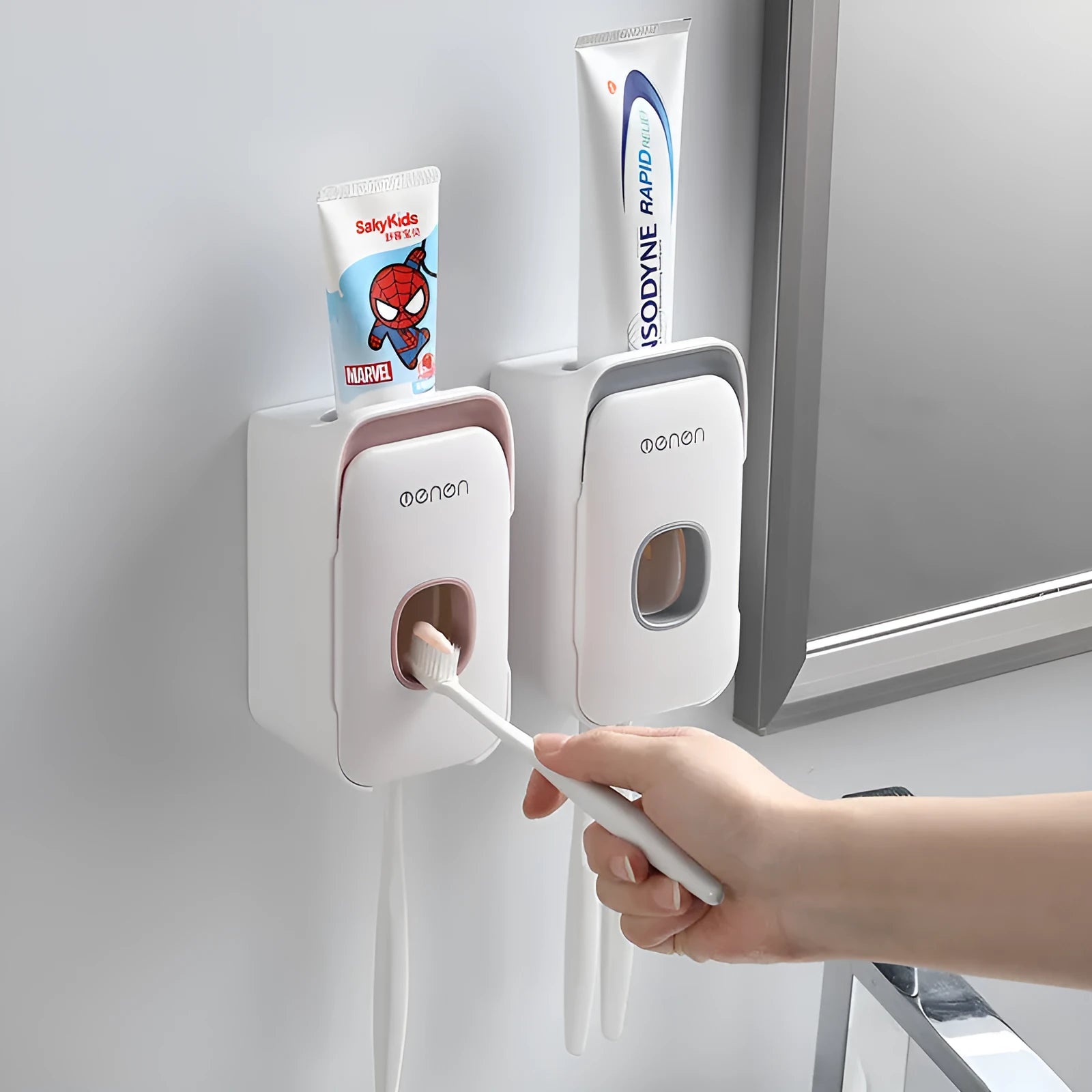 Automatic toothpaste dispenser mounted on bathroom wall in blue colour with touchless sensor
