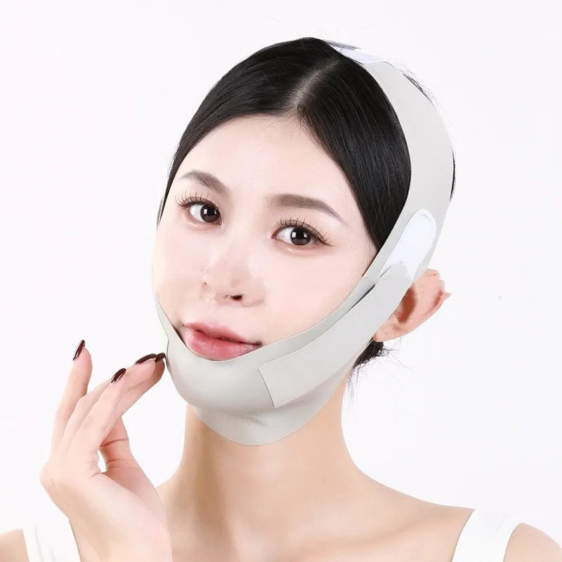 Small V face shaping mask in light breathable fabric, purple and green graphene colours.