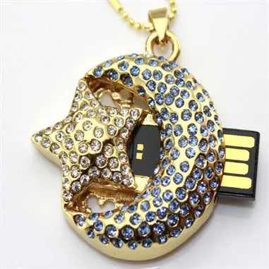 Silver jewellery-shaped metal USB flash drive on a white background.