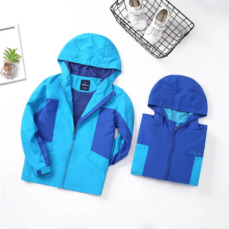 Blue boys' thin autumn jacket with long sleeves and a front zip, laid flat.