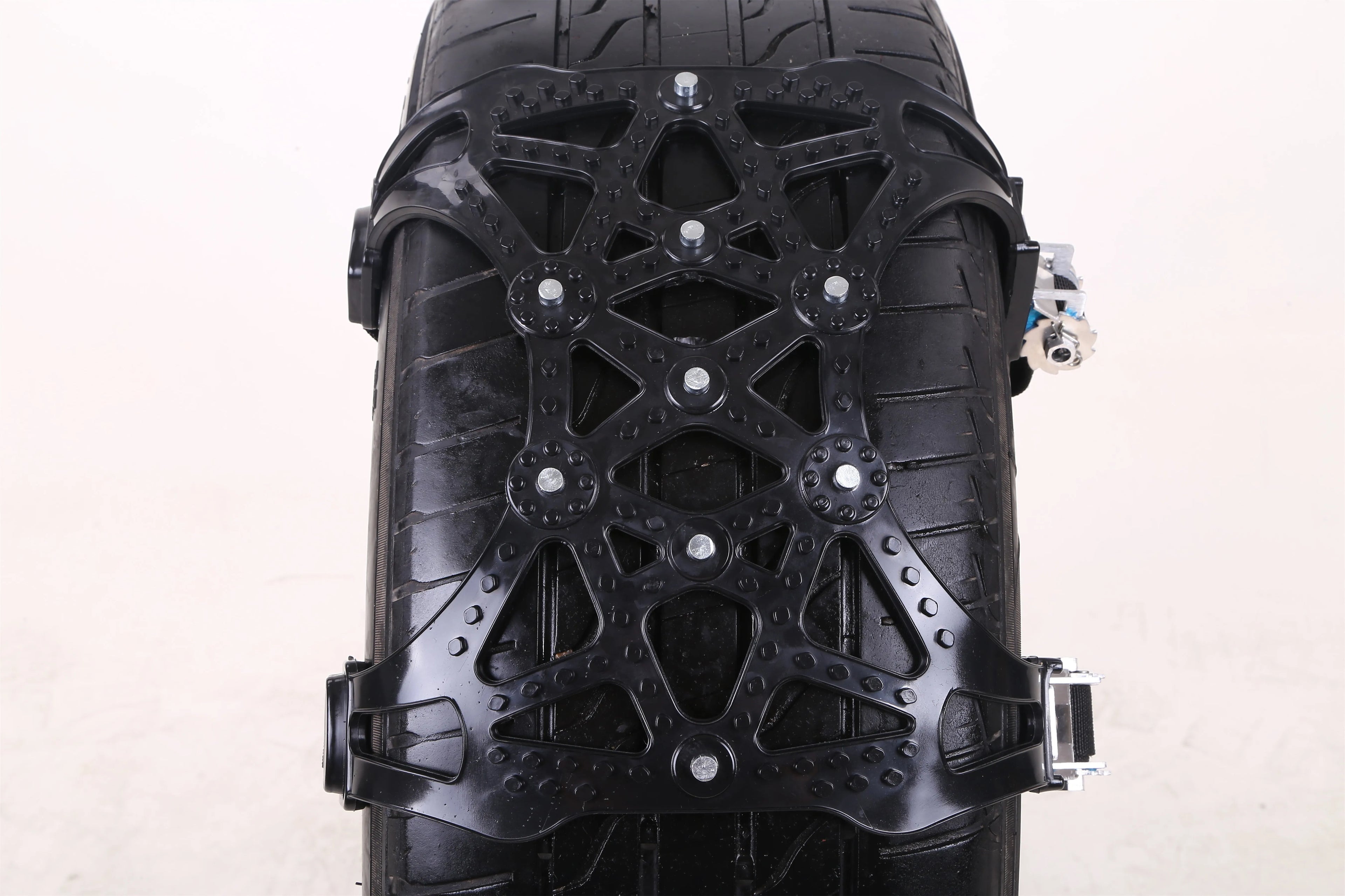 Yellow universal snow chain made from widened thickened TPU with steel nails for non-slip winter traction