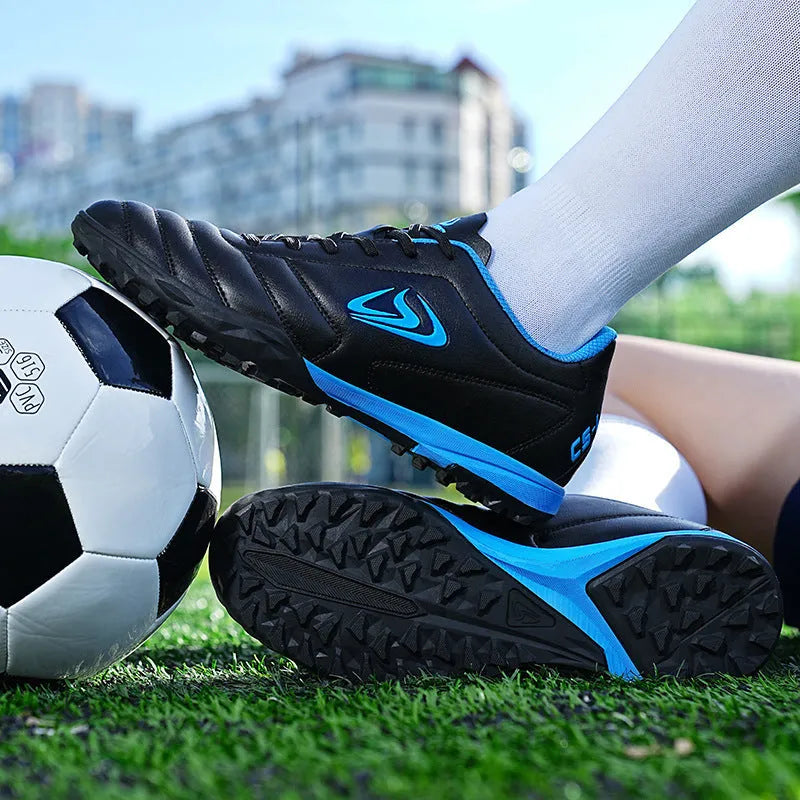 Low-top outdoor soccer football boots in a broken nail colour design with a synthetic leather upper and rubber sole.