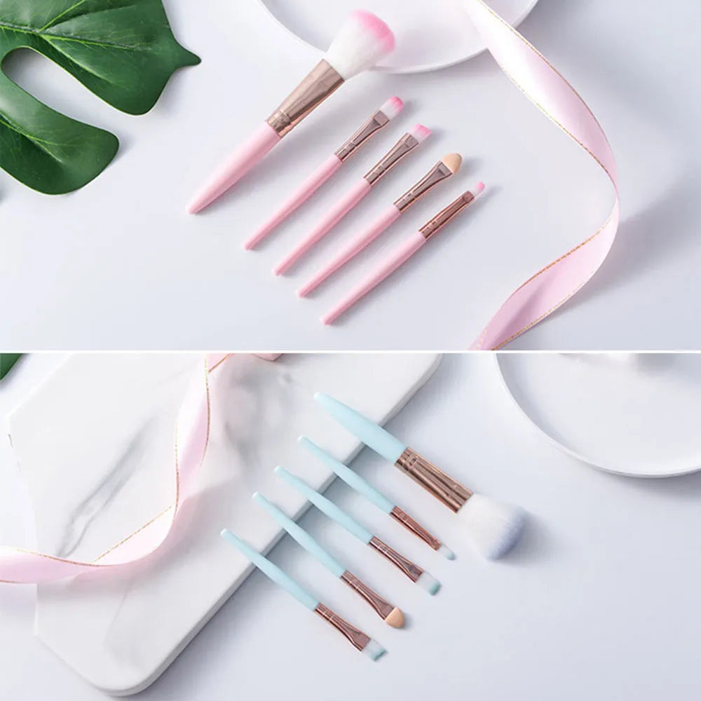 Five mini makeup brush set with plastic handles, short rod design, and man-made fiber bristles in OPP bag packaging