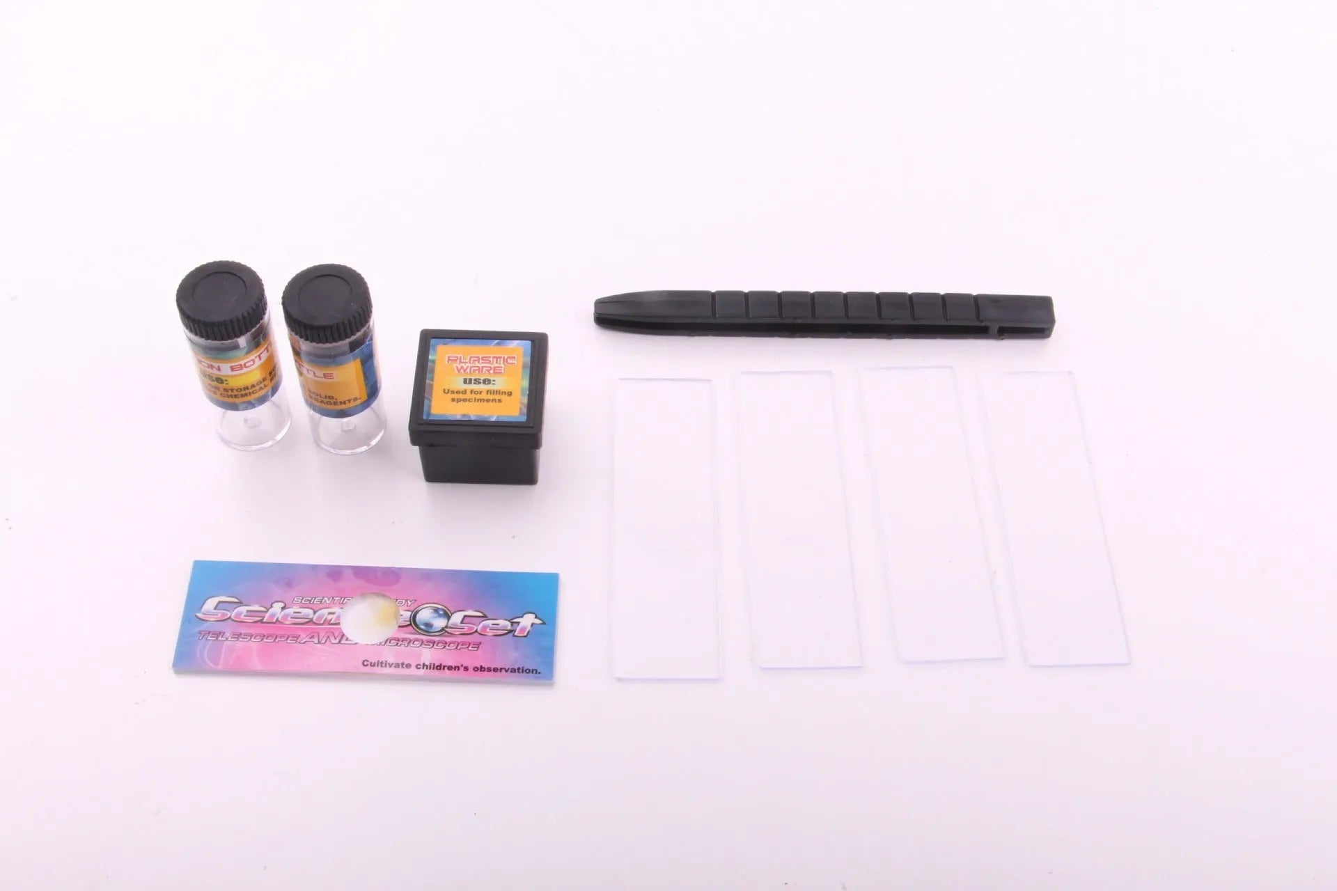Child biological microscope with LED light, three objective lenses, and coarse focus knob on white background