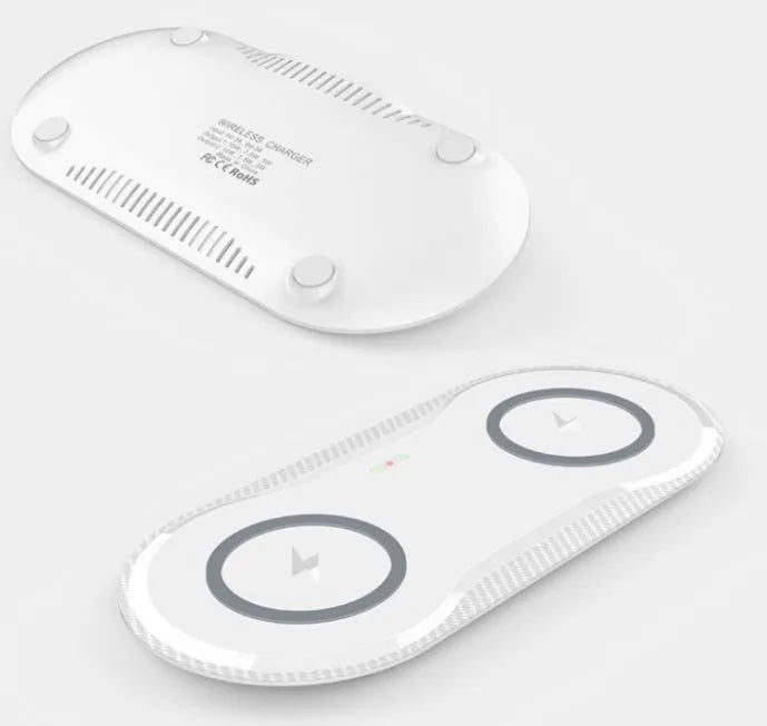Black and white dual wireless charging pad with two phones charging simultaneously