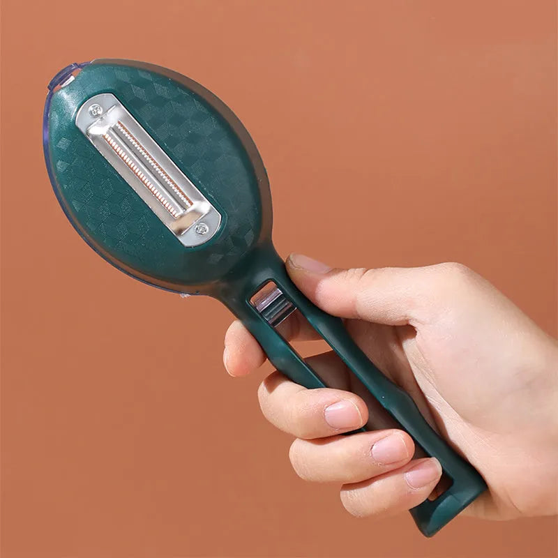 Yellow peeling knife with a protective storage lid on a dark background.