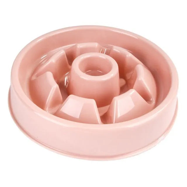 Plastic slow food bowl for dogs and cats with flower-shaped internal obstacles, pink colour, choke prevention design.