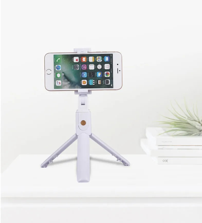 Bluetooth selfie stick tripod folded at 195mm in A White colour, compatible with iPhone Android and Huawei smartphones