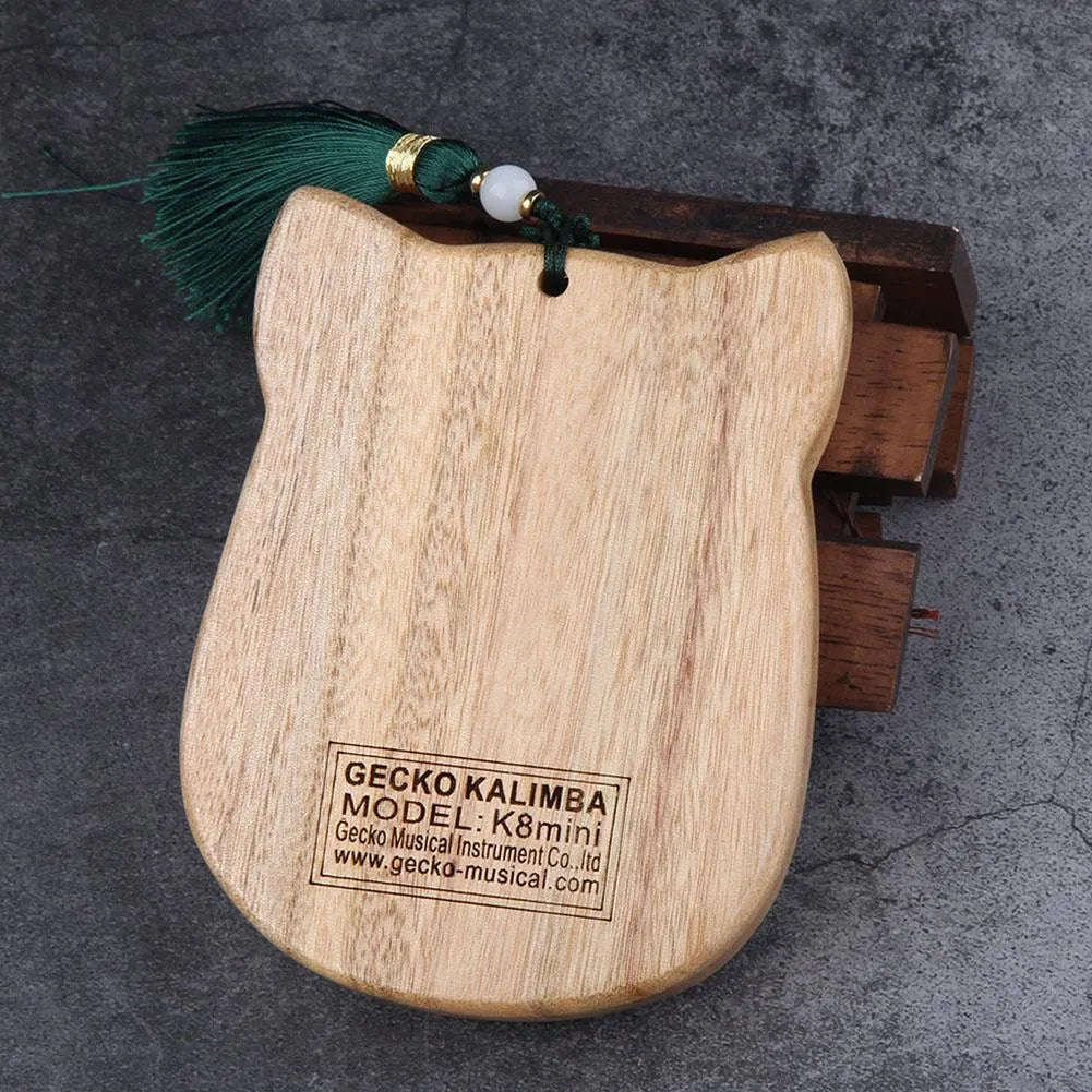 Camphorwood Mini K8 keyboard percussion instrument with five C sounds, 11.5 x 9 x 3 cm, natural wood colour.