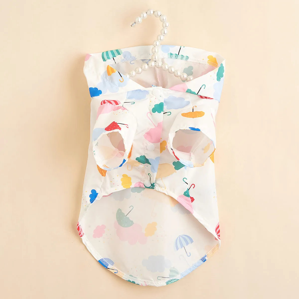 Colourful cartoon umbrella print dog raincoat in polyester, shown in size L.