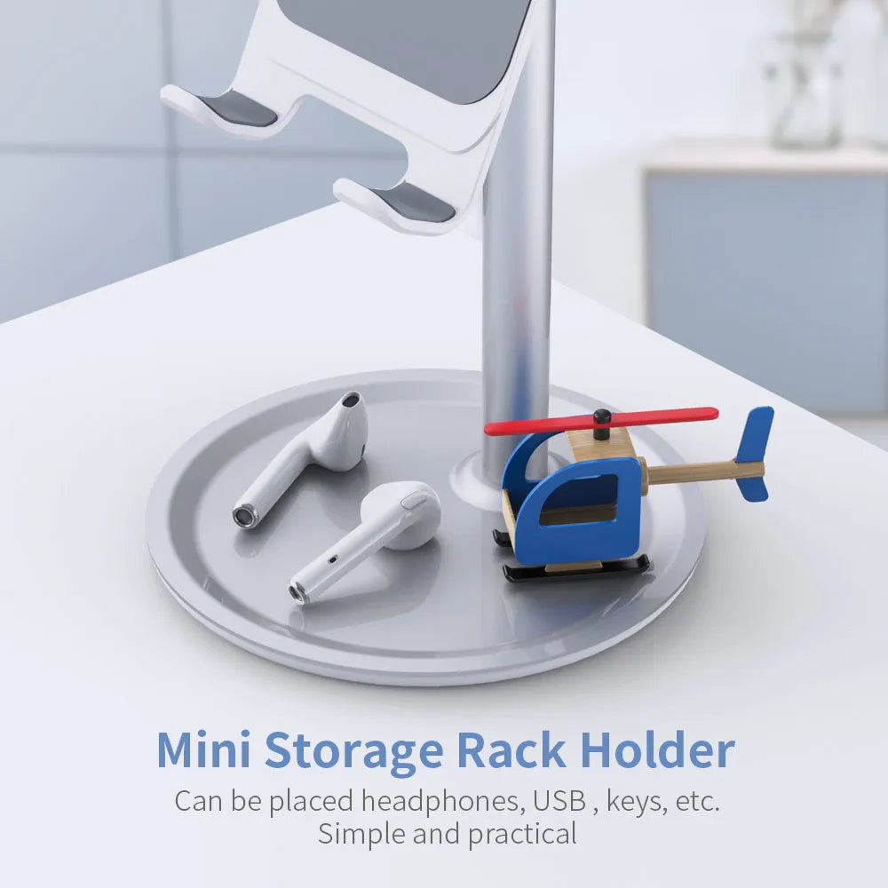 Silver white aluminium alloy mobile phone stand holding a smartphone on a desk