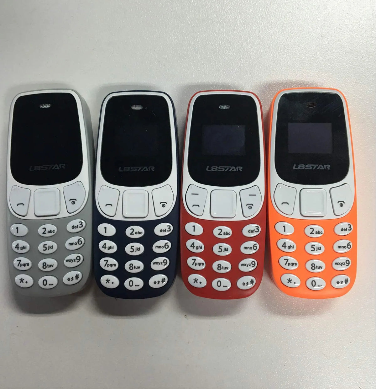 Miniature thumb phone dual SIM ultra-small OLED display blue colour front view