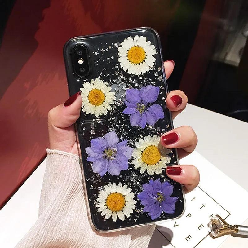 Qianliyao handmade clear TPU iPhone case with pink dried flowers encased in epoxy resin on the back.