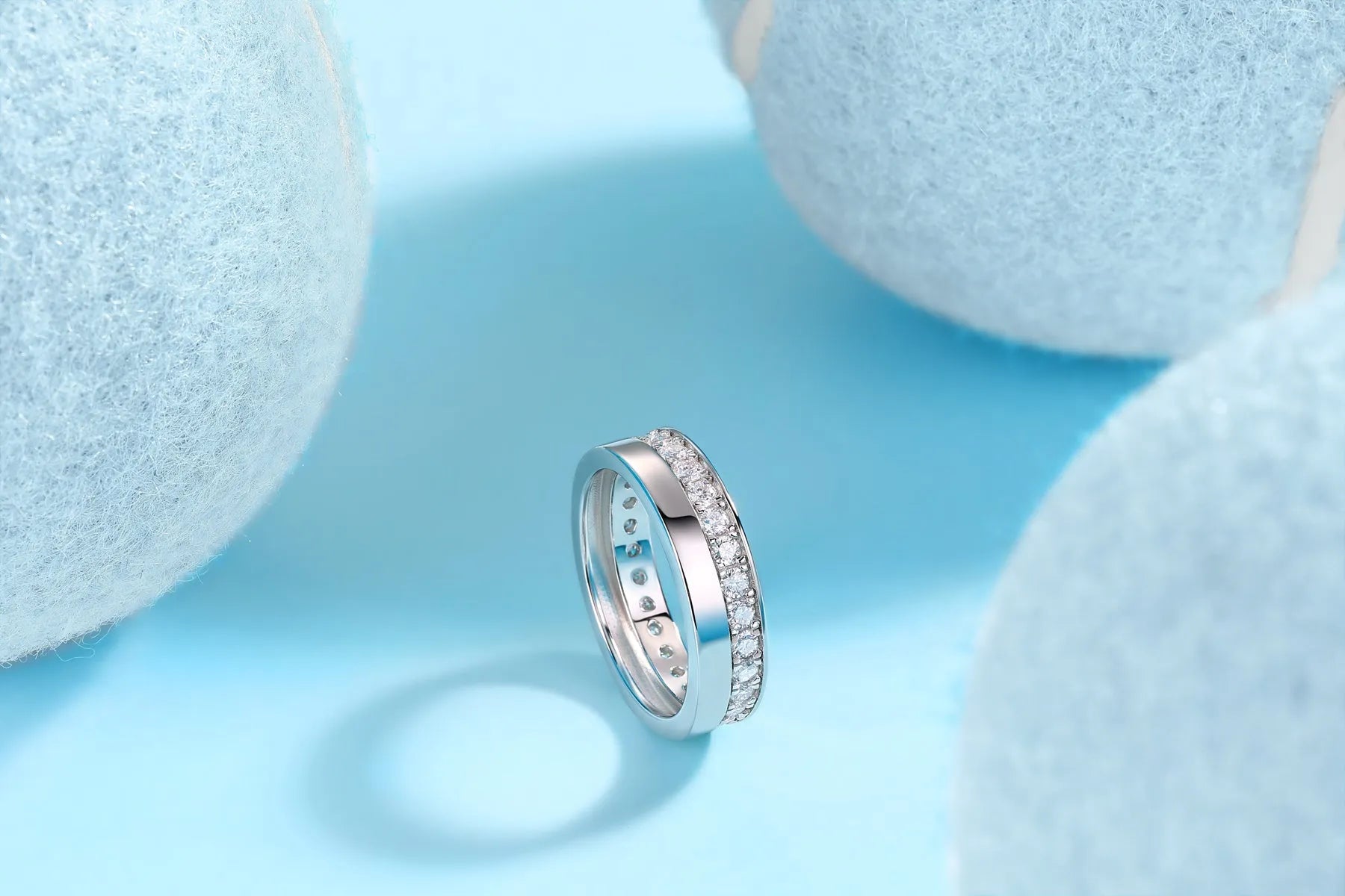 Moissanite wedding ring with gold-plated S925 silver setting on a white background