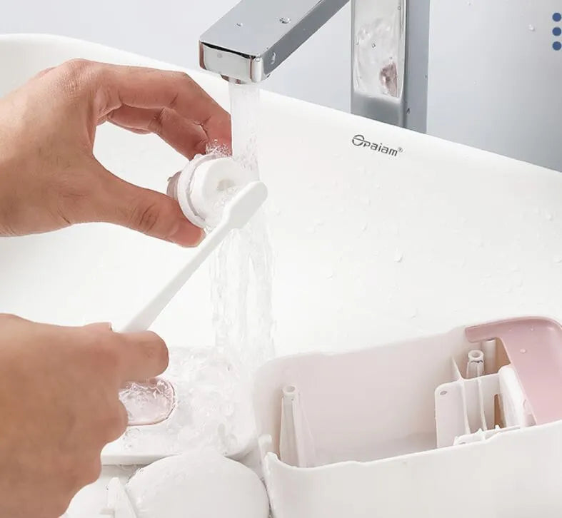 Automatic toothpaste dispenser mounted on bathroom wall in blue colour with touchless sensor