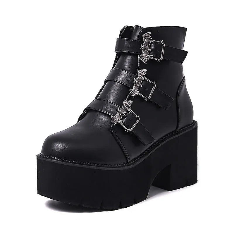 Black women's punk gothic short ankle boots with a bat buckle and side zip.