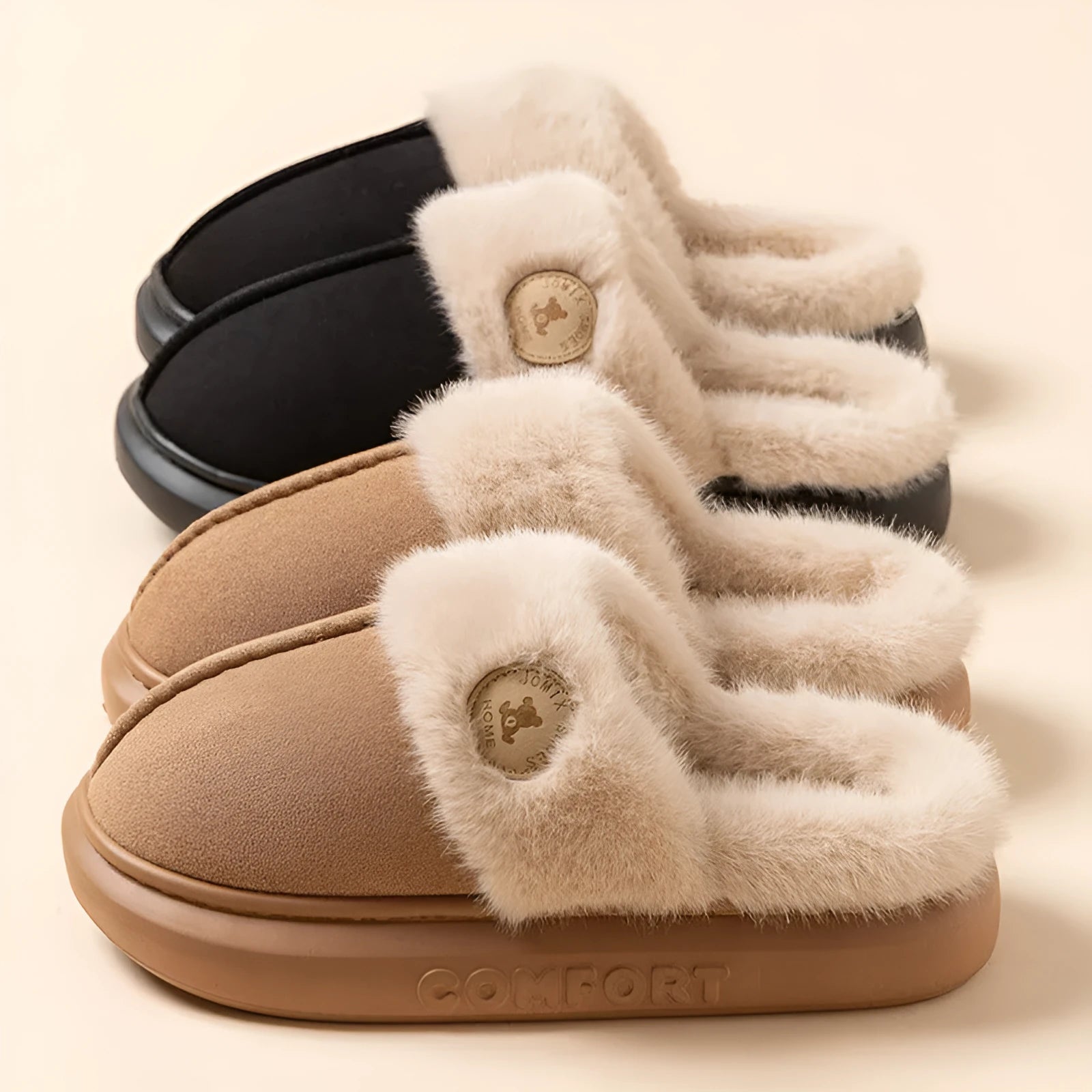 Pair of thick-soled fleece indoor slippers in a chosen colour, showing car stitching detail on the upper.