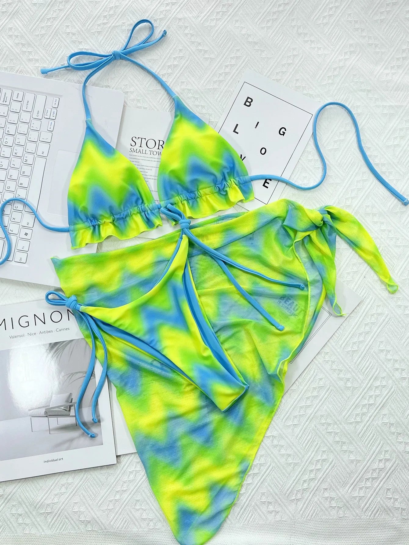 Green tie dye women's two-piece swimsuit bikini set with bra, briefs, and skirt.