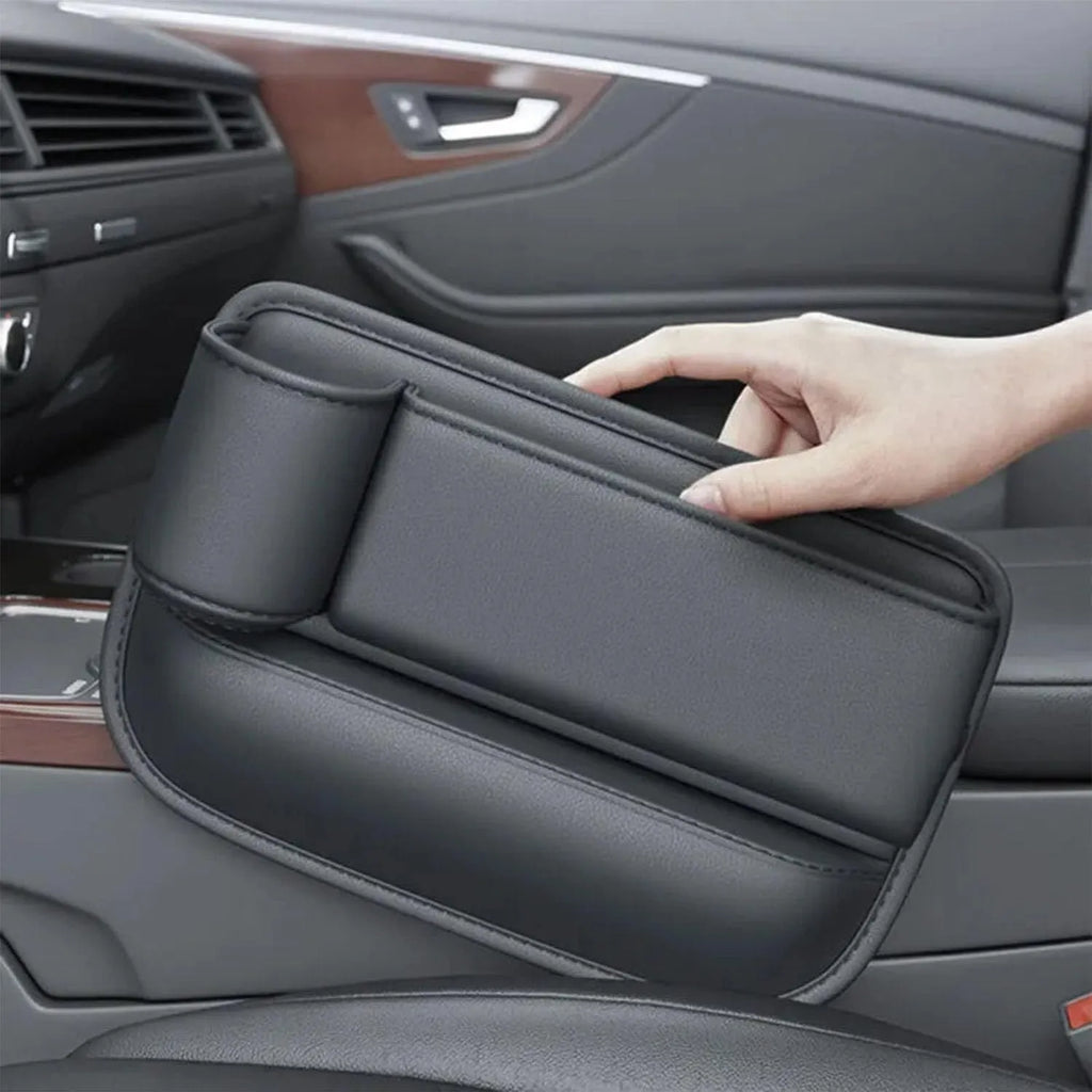 Car seat gap storage box with cup holder in black PU leather and ABS plastic fitted between car seat and centre console