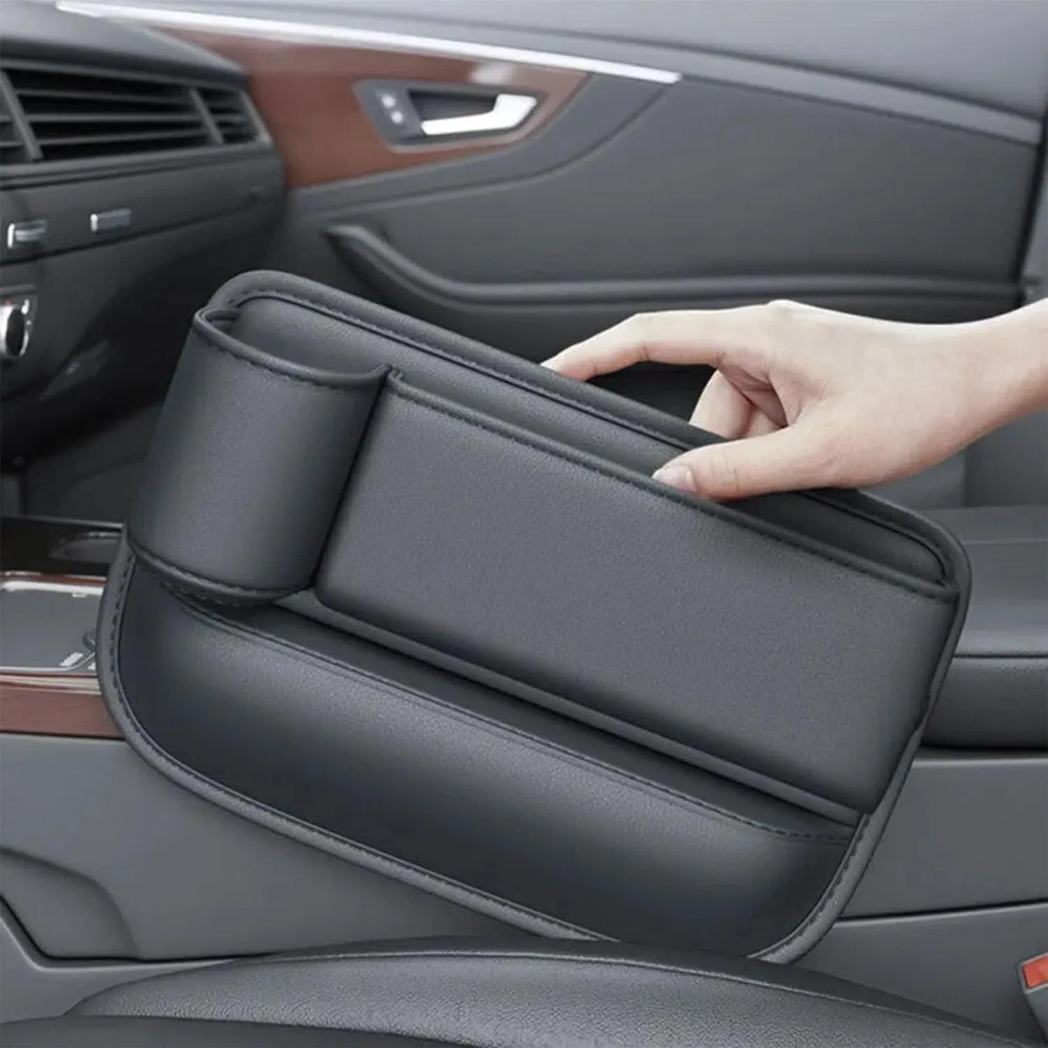 Car seat gap storage box with cup holder in black PU leather and ABS plastic fitted between car seat and centre console