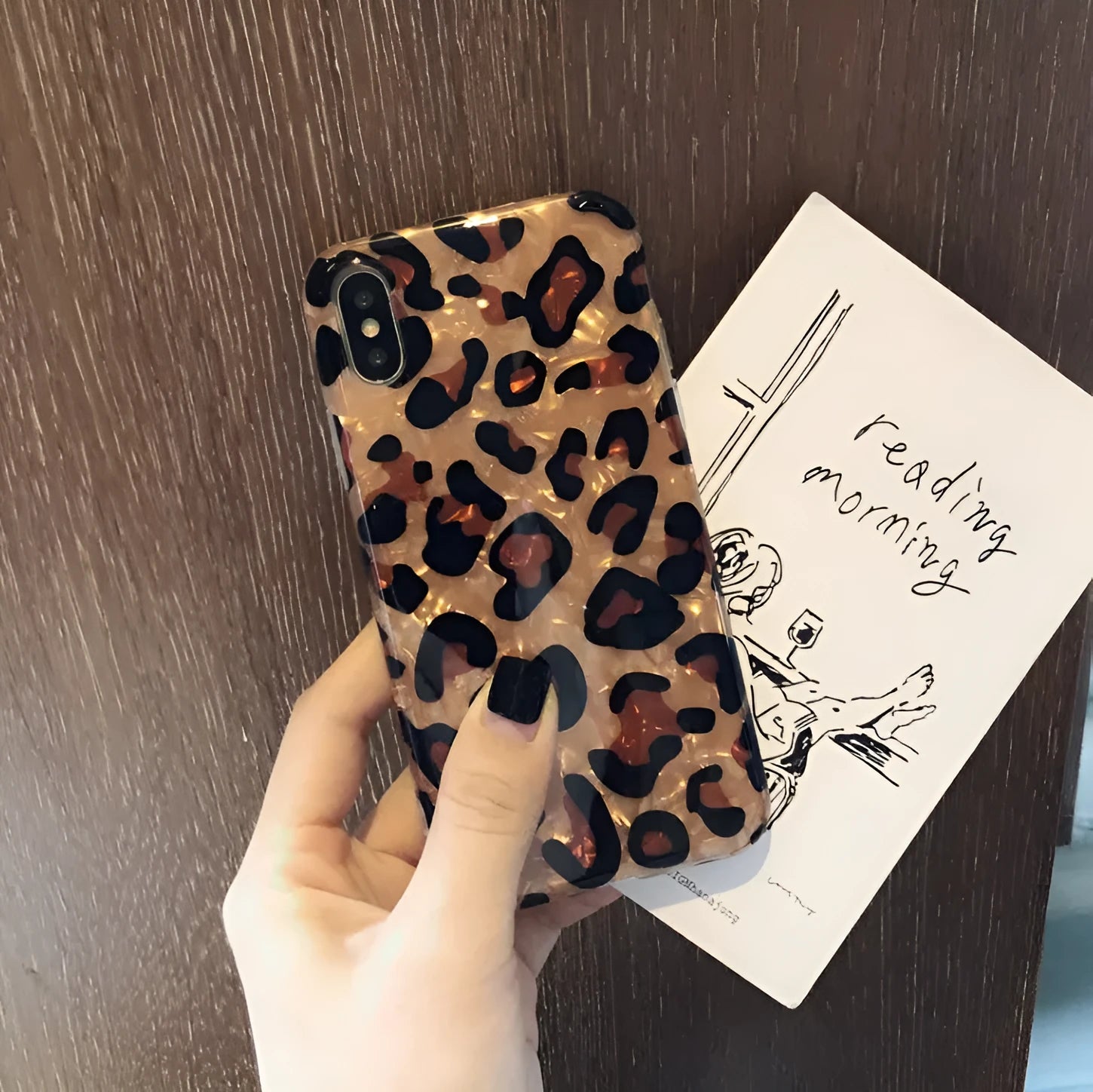 Leopard print patterned silicone phone case for iPhone on a table