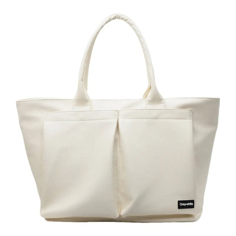 Lightweight PU shoulder bag in solid colour with ventilation, shown in black, green, or white.