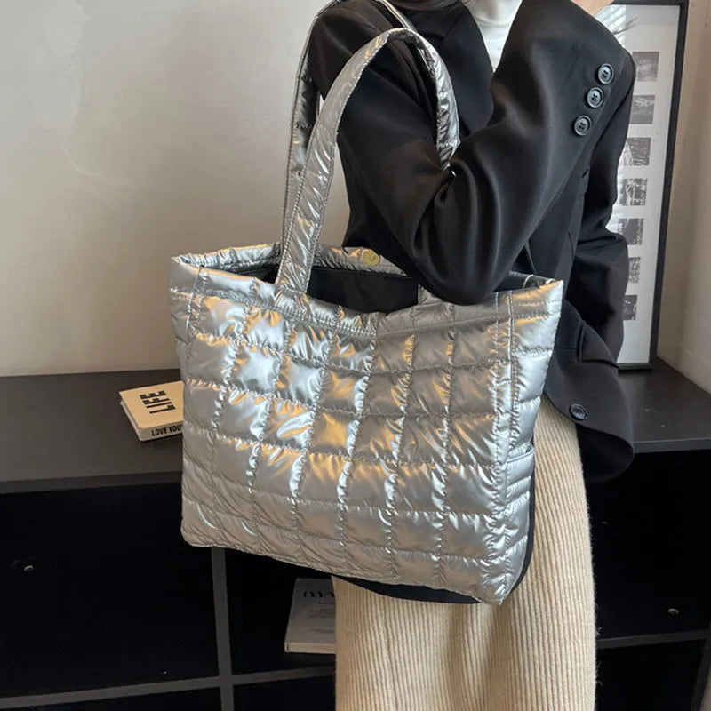 Large nylon plaid bucket shoulder bag in black with rhombus pattern, magnetic buckle, and soft handle.