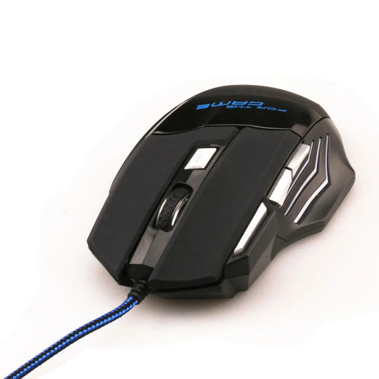 Black wired USB gaming mouse with Tyrannosaurus Rex design, six buttons, and colourful LED light on a desk