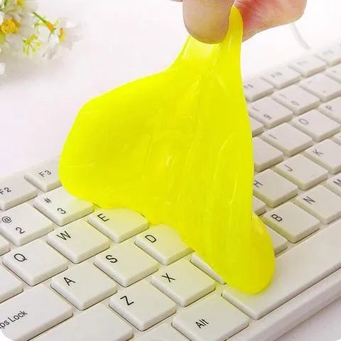 Blue and yellow Magic Cleaning Gel blocks, a reusable 160g adhesive putty for dust removal.