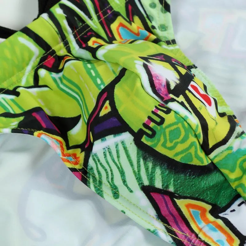 Men's printed swimming trunks in polyester fabric showing Cyber, Ice Cream, Streamer, and Skull pattern options.