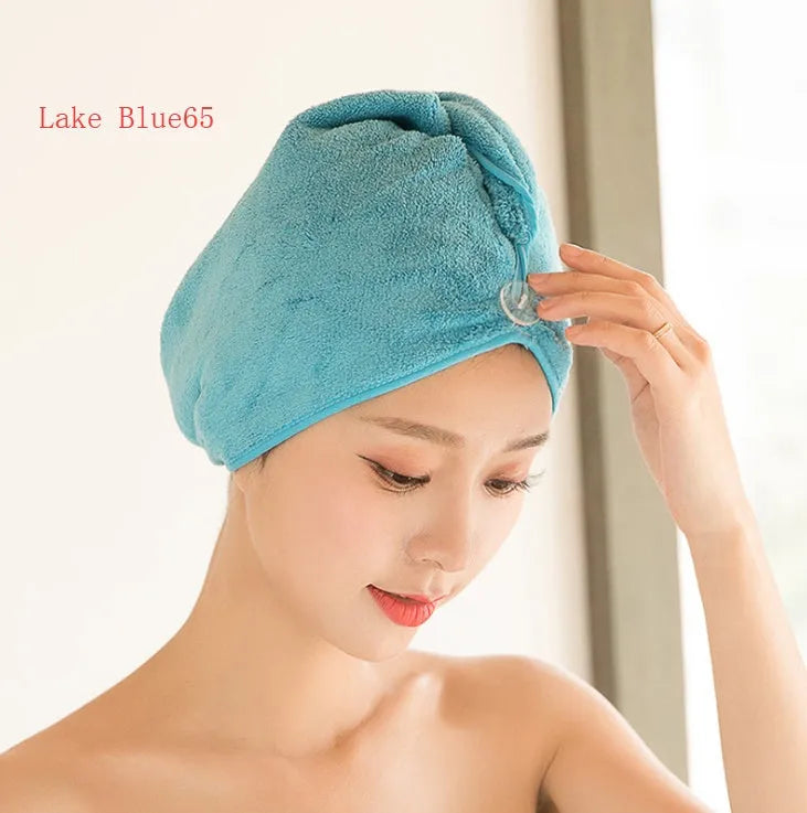 Women's microfiber hair drying cap in a light colour, showing its absorbent fabric and cap shape.