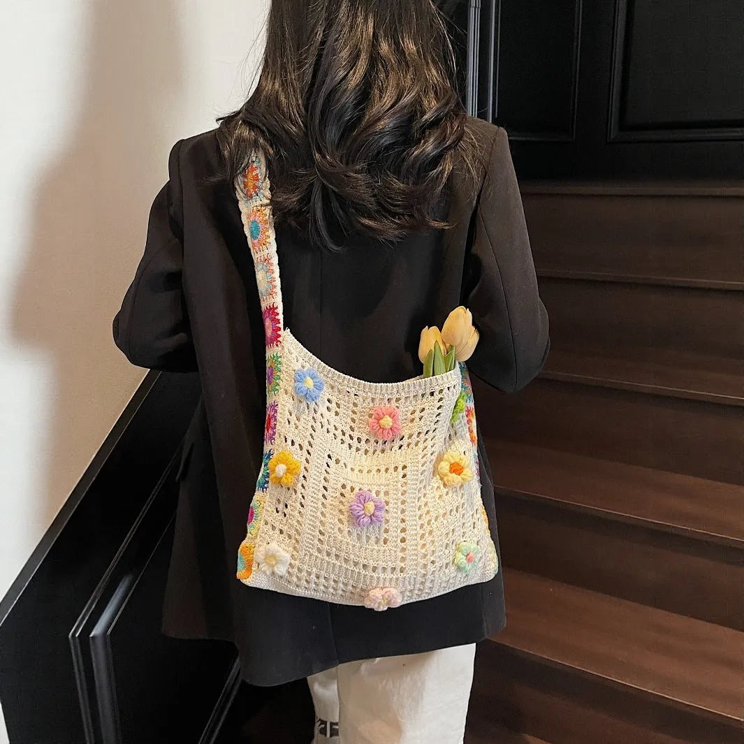 Woven polyester beach shoulder bag in milky white colour showing hollow knit pattern and single strap
