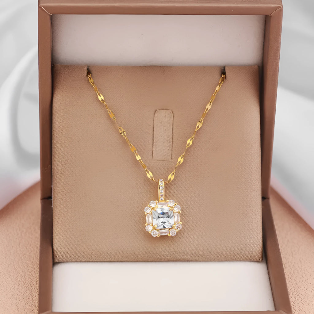 Gold-toned titanium steel necklace with geometric quadrilateral zircon pendant on a water wave chain.