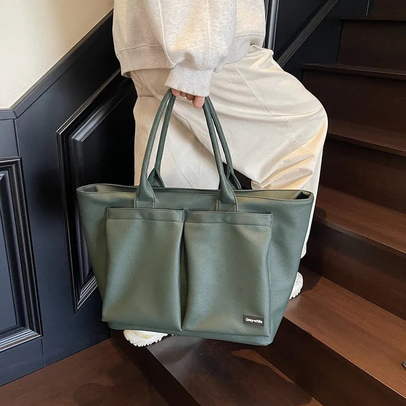 Lightweight PU shoulder bag in solid colour with ventilation, shown in black, green, or white.