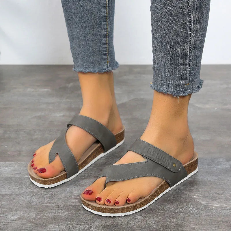 Flat toe ring thick-soled flip-flops in a solid colour with artificial PU upper and foam sole.